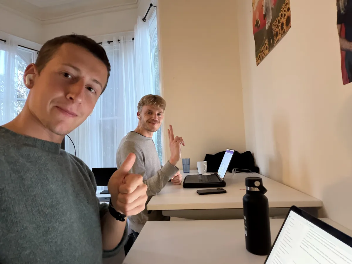Rory and Malthe working together at a table